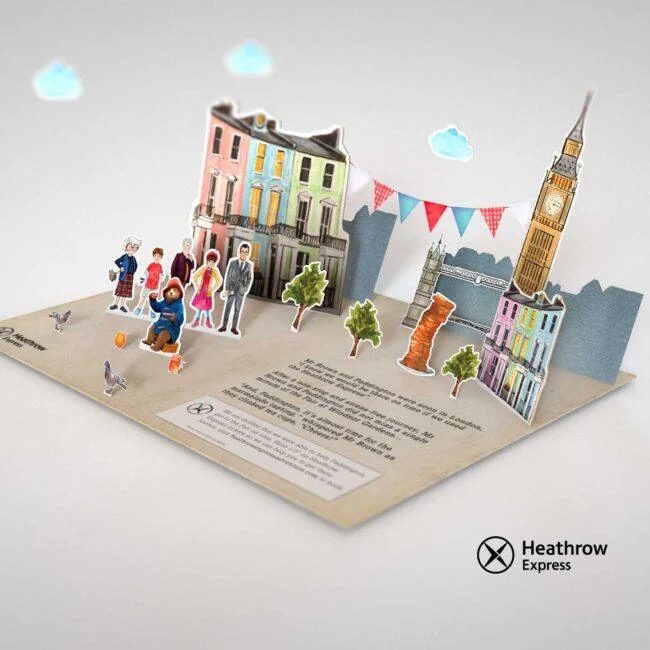 Papierowa scena Londynu z Paddingtonem, kamienicami i Big Benem dla Heathrow Express AR.