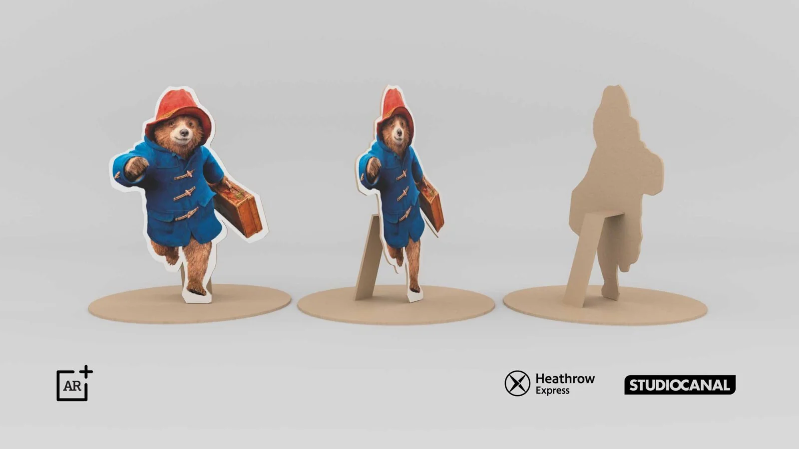 Widoki papierowego modelu Paddingtona z przodu, z boku i jako sylwetka.